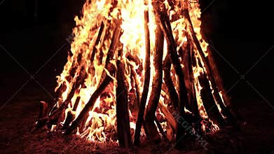 A view of burning bonfire against the darkness of a night