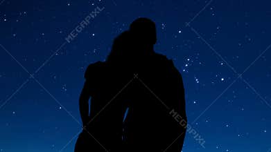 Loving couple shadow hugging and looking at stars in night sky, romantic date