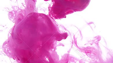Pink ink dropped in water on white background