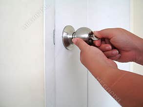 Open the door with a key.