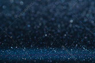 Abstract dark navy blue sparkling glitter wall and floor perspective background studio with blur bokeh.luxury holiday backdrop mo