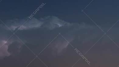 Thunderstorm clouds at night with lightning