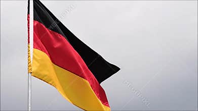 The flag of Germany waves in the wind in slow motion