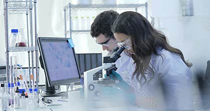 Dolly Shot of Medical Research Scientists Team Work on Modern Laboratory with Scientists Conducting experiments, Working