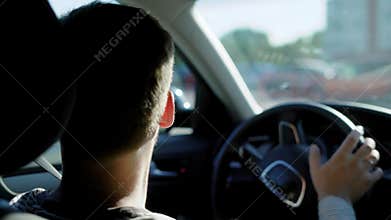 Anonymous man driving car