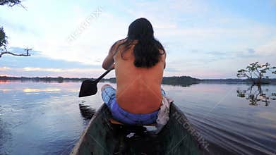Indigenous Man On Wooden Canoe,