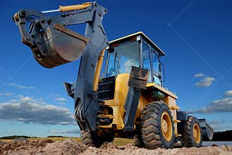 Rear view of Loader excavator with rised backhoe
