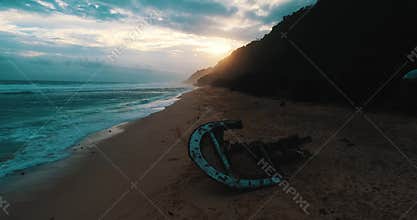 Aerial view of shipwreck at the beach during amazing sunset