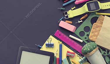 Banner Concept back to school apple backpack stationery on black background.