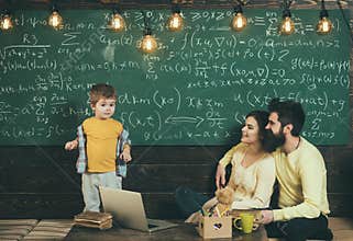 Home schooling. Home schooling pupil at chalkboard. Home schooling education with parents. Family choose home schooling
