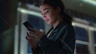 Attractive young woman with cellphone chatting.