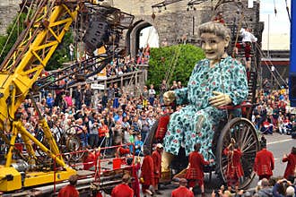 Crew of Royal de Luxe theatre controlling giant mechanical doll