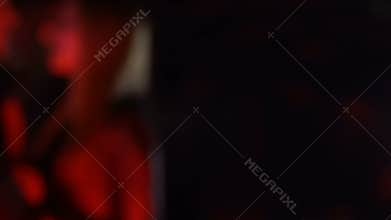 Wine bottle on bar table on dancing couple background, night life relations