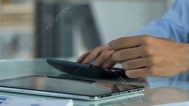 Frustrated man calculating income and expenses, upset by business bankruptcy