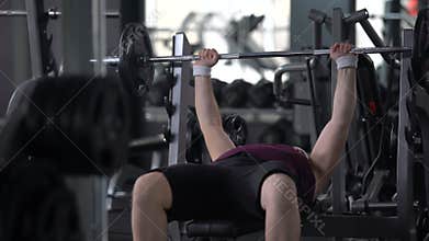 Chubby man feeling tired of lifting barbell, weight loss gym workout, strength