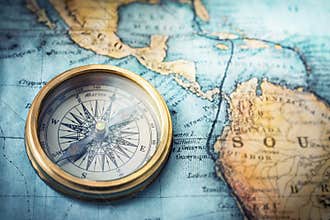 Magnetic compass on world map. Travel, geography, navigation, tou