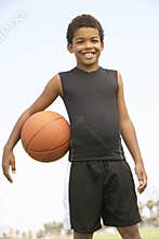 Young Boy Playing Basketball
