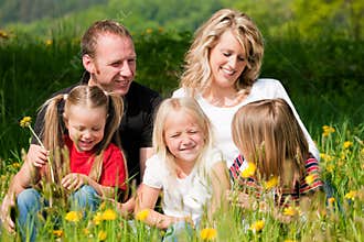 Happy family in early summer