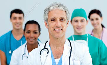 Multi-ethnic medical team standing