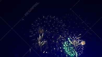 Many bright fireworks crack in the sky.