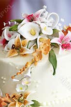 Beautiful flowers on top of a wedding cake