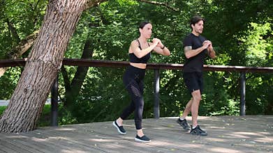Young couple practicing lunge exercise