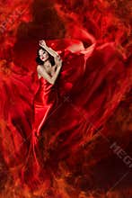 Woman in red waving dress as fire flame