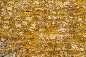 Ancient old castle beige light stone wall. Background texture