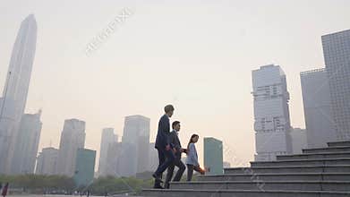 Team asian business people walking in city downtown