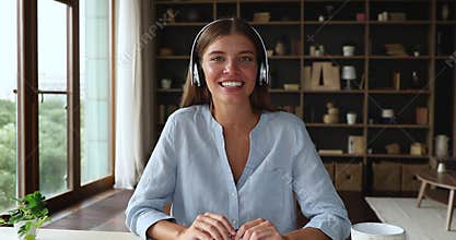 Motivated young lady speak before webcam on distant job interview