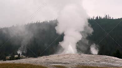 Wyoming, Yellowstone National Park  The beginning of Old Faithful erupting at the North Gyser Basin