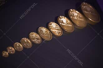 Queen Elizabeth`s third set of Exchequer standard avoirdupois weights displayed at Science Museum in London
