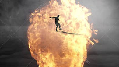 3d render of silhouette soccer player in burning fire and fog shooting penalty or free kick in slow motion