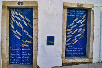 Old wooden doors with poem and artwork