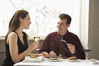 Couple dining at restaurant.