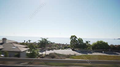 Driving plate side view moving near coast line