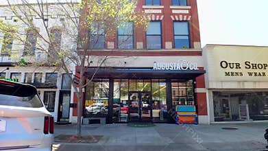 Historic small town USA Downtown Augusta Ga Broad street People and storefronts slow motion