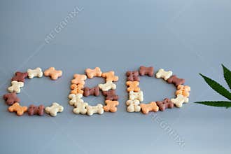 CBD lettering written from dog or cat food. CBD cannabis or hemp content in pet treats