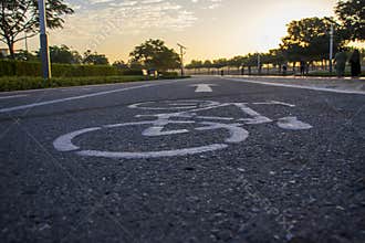 Jogging and cycling tracks in Al Warqa park, Dubai, UAE early in the morning. Lamp post powered by solar panels can be seen in the