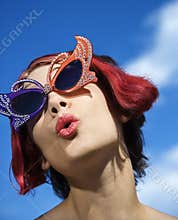 Woman wearing unique glasses.