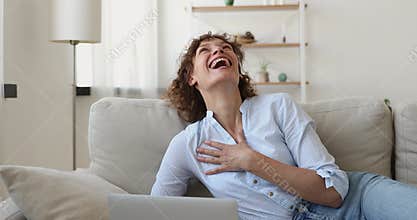 Emotional young adult woman getting email with pleasant good news.
