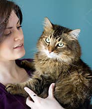 Young woman with pet cat