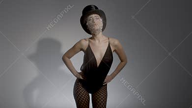 Young woman wearing top hat with sparkly veil and bustier