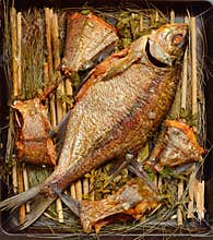 Long-cooked fish. Baked in a Russian oven on straw