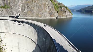 The arched concrete wall of Vidraru Dam in Romania