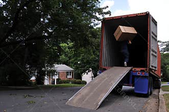 Carrying box into moving truck
