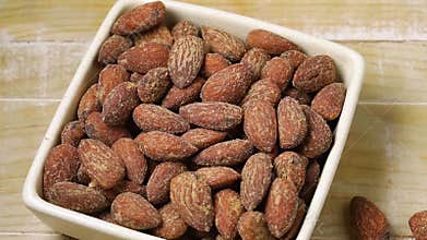 Bowl with smoked salted almonds full frame close up for a snack