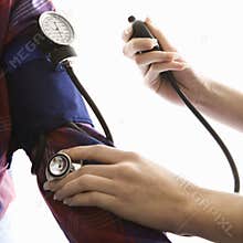 Doctor checking blood pressure