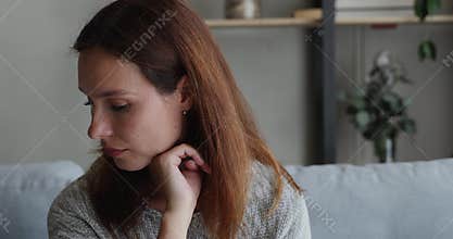 Bored young 30s european red-haired woman feeling unhappy.