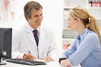 Male doctor with female patient